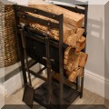 D08. Cast iron firewood stand and fireplace tools. 